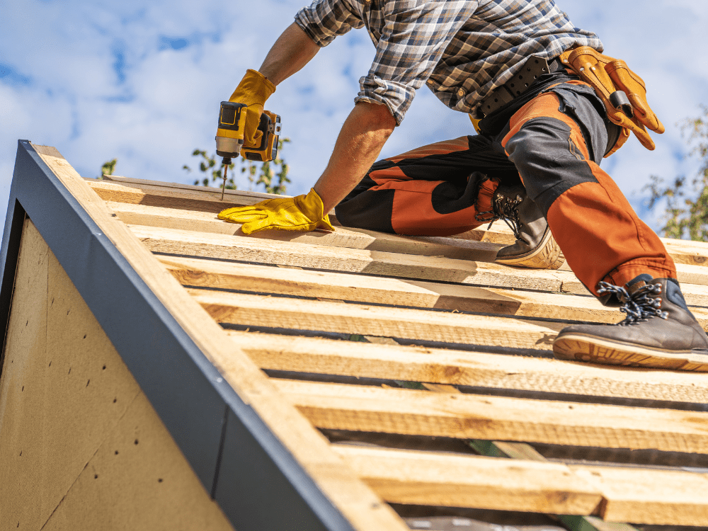 Installing a Roof Underlayment Stock Image